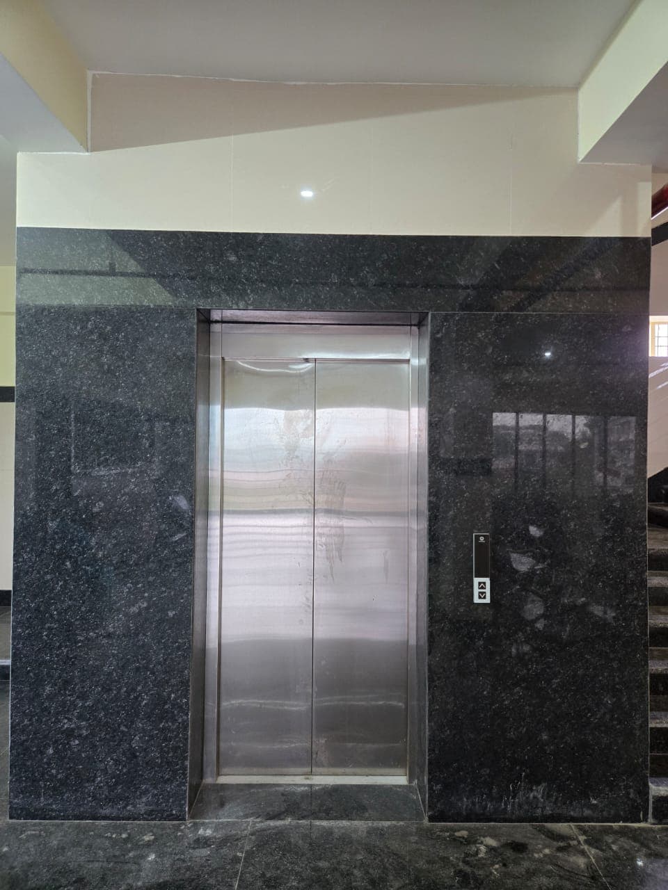 Black granite elevator wall cladding at a client project