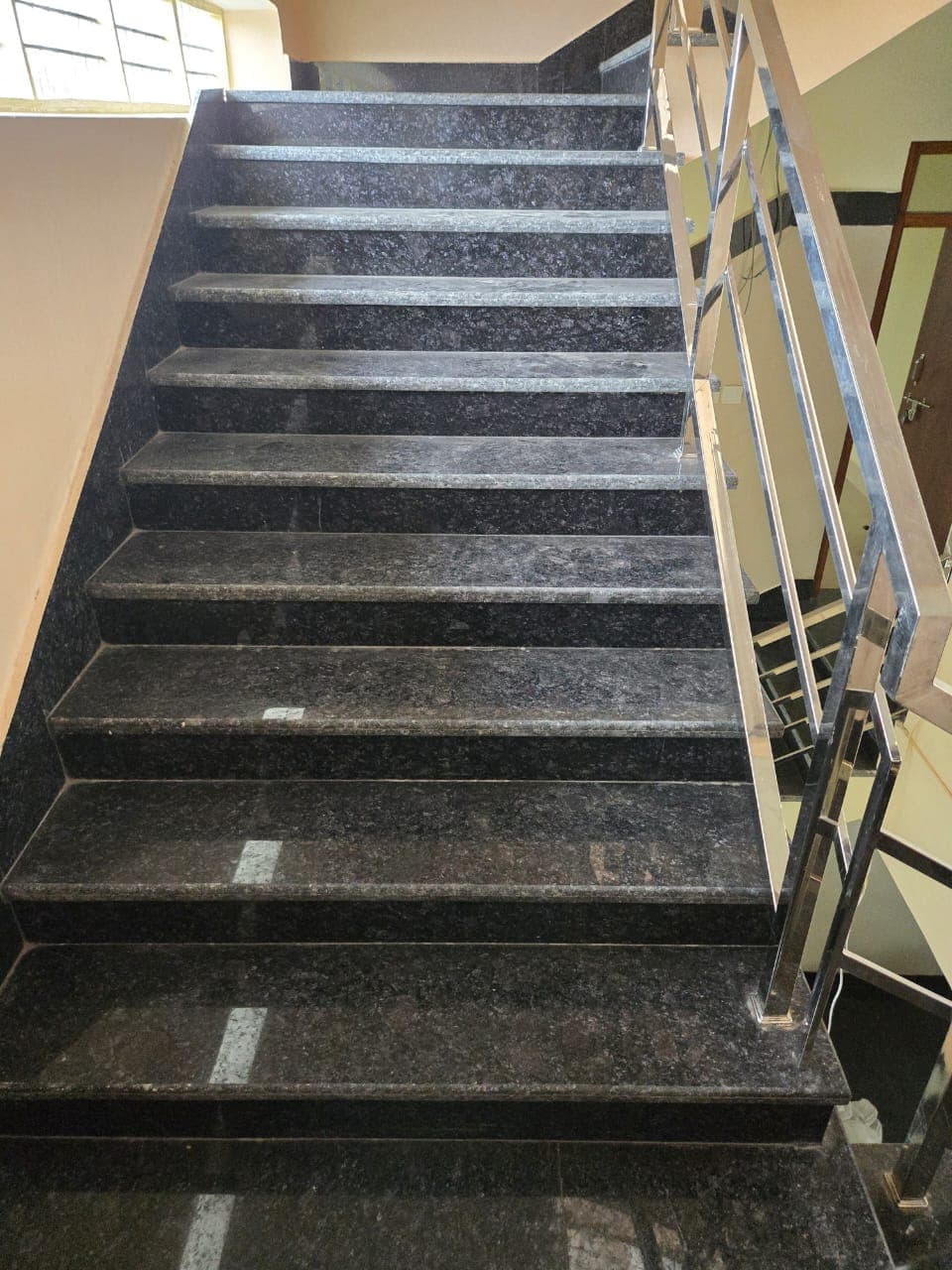 Black granite stairs installed at a client project