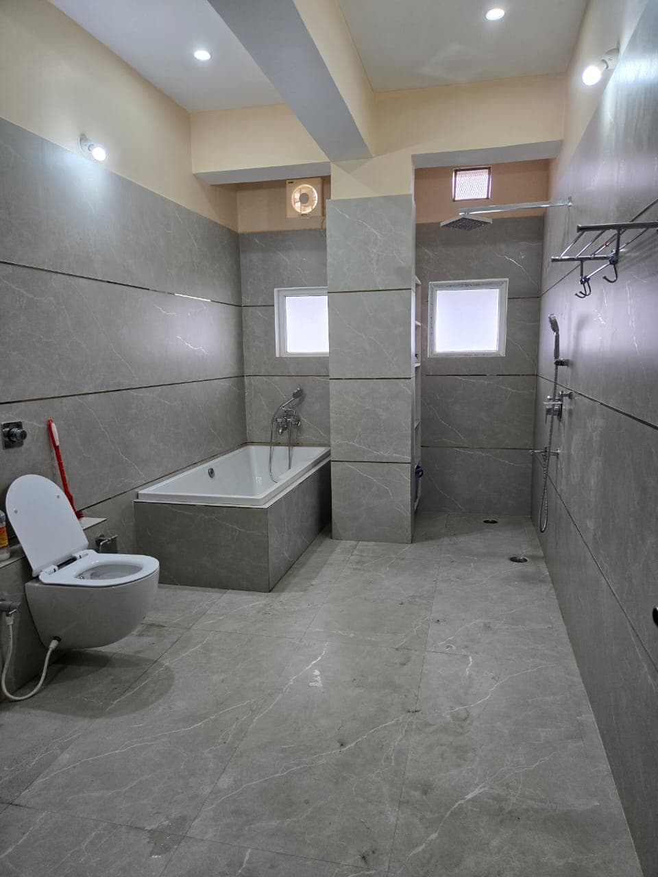 Finished bathroom wall and floor tiles at a client project